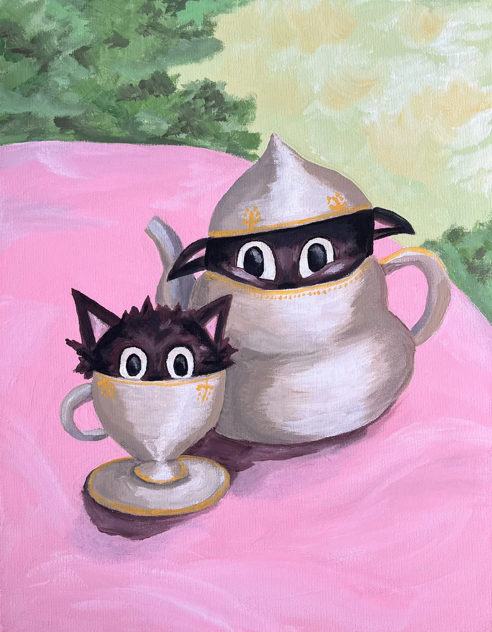 A silver teapot and teacup with cat faces and dark eye masks, sitting on a pink cloth against soft green.
