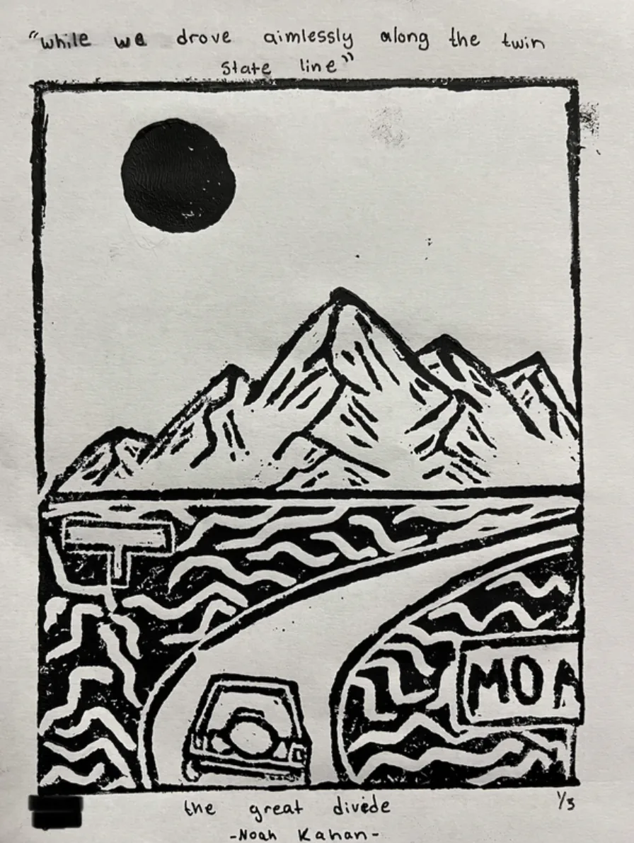 A black-and-white linocut print of mountains beneath a dark sun, with a patterned foreground.